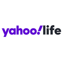 The image shows the "Yahoo! Life" logo. The word "yahoo!" is in purple lowercase letters with an exclamation mark, and "life" is in black lowercase letters.